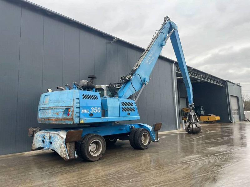 Hulladék kotró a következők szállításához hulladék Fuchs MHL350: 5 kép.