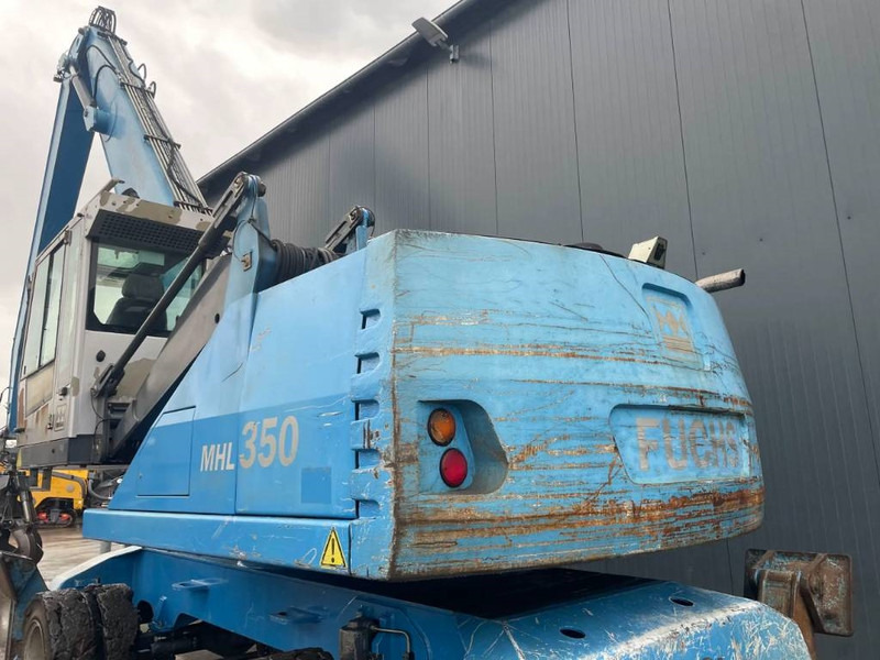 Hulladék kotró a következők szállításához hulladék Fuchs MHL350: 9 kép.