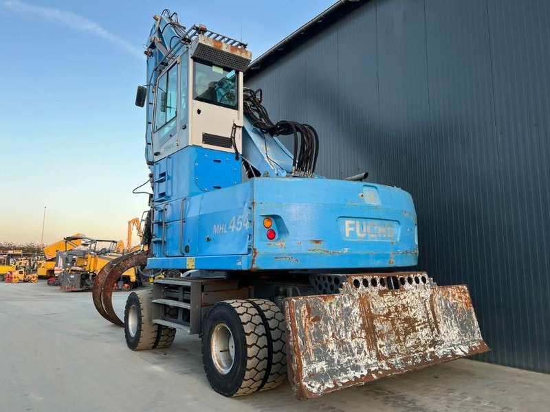 Fuchs MHL454 - Hulladék kotró: 2 kép. Fuchs MHL454 - Hulladék kotró: 2 kép.