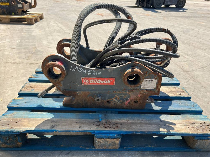OilQuick OQ60 - 311F / 313F / 315F - Gyorscsatlakozó - Építőipari gépek: 4 kép. OilQuick OQ60 - 311F / 313F / 315F - Gyorscsatlakozó - Építőipari gépek: 4 kép.
