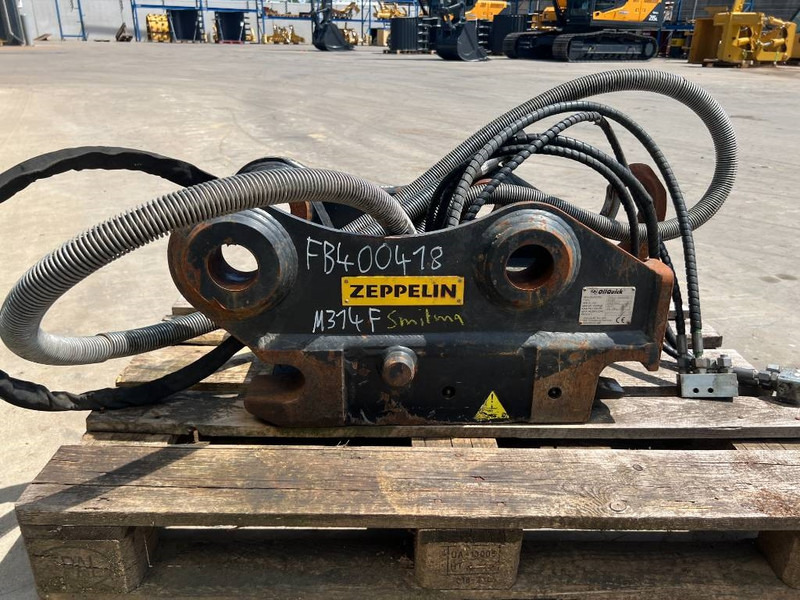 OilQuick OQ65 - M314F / M316F / M318F - Gyorscsatlakozó - Építőipari gépek: 4 kép. OilQuick OQ65 - M314F / M316F / M318F - Gyorscsatlakozó - Építőipari gépek: 4 kép.