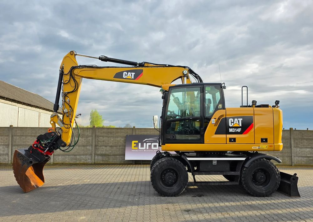 Caterpillar M314F, 2016 ROK, GŁOWICA ROTOTILT, 4400 MTH - Gumikerekes kotró: 3 kép. Caterpillar M314F, 2016 ROK, GŁOWICA ROTOTILT, 4400 MTH - Gumikerekes kotró: 3 kép.