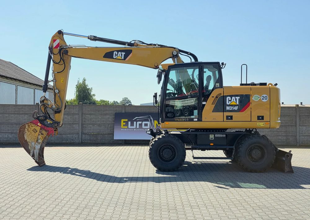 Caterpillar M314F, 2019 ROK, 3300 MTH, OIL QUICK OQ 65 - Gumikerekes kotró: 2 kép. Caterpillar M314F, 2019 ROK, 3300 MTH, OIL QUICK OQ 65 - Gumikerekes kotró: 2 kép.
