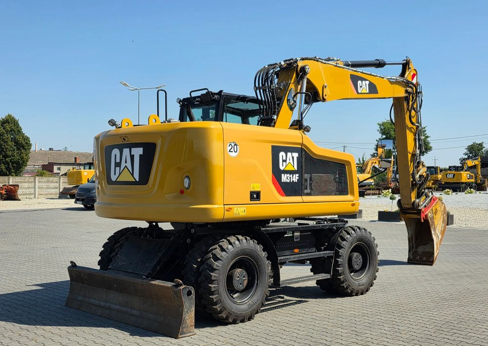 Caterpillar M314F, 2019 ROK, 3300 MTH, OIL QUICK OQ 65 - Gumikerekes kotró: 5 kép. Caterpillar M314F, 2019 ROK, 3300 MTH, OIL QUICK OQ 65 - Gumikerekes kotró: 5 kép.