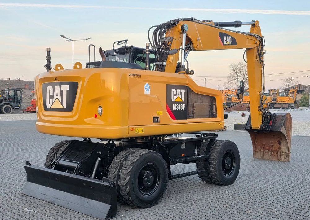 Caterpillar M318F, 2019 ROK, IMPORT NIEMCY - Gumikerekes kotró: 5 kép. Caterpillar M318F, 2019 ROK, IMPORT NIEMCY - Gumikerekes kotró: 5 kép.