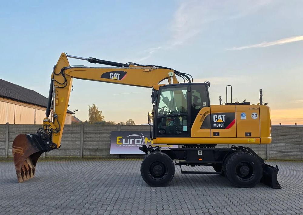 Caterpillar M318F, 2019 ROK, IMPORT NIEMCY - Gumikerekes kotró: 2 kép. Caterpillar M318F, 2019 ROK, IMPORT NIEMCY - Gumikerekes kotró: 2 kép.