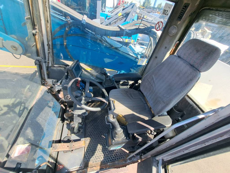 Hulladék kotró a következők szállításához hulladék Fuchs MHL 335: 6 kép. Hulladék kotró a következők szállításához hulladék Fuchs MHL 335: 6 kép.