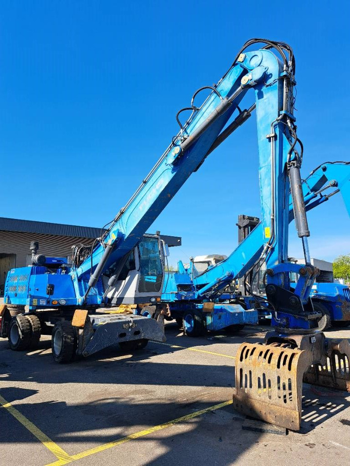 Fuchs MHL331E + Grapple - Hulladék kotró: 2 kép. Fuchs MHL331E + Grapple - Hulladék kotró: 2 kép.