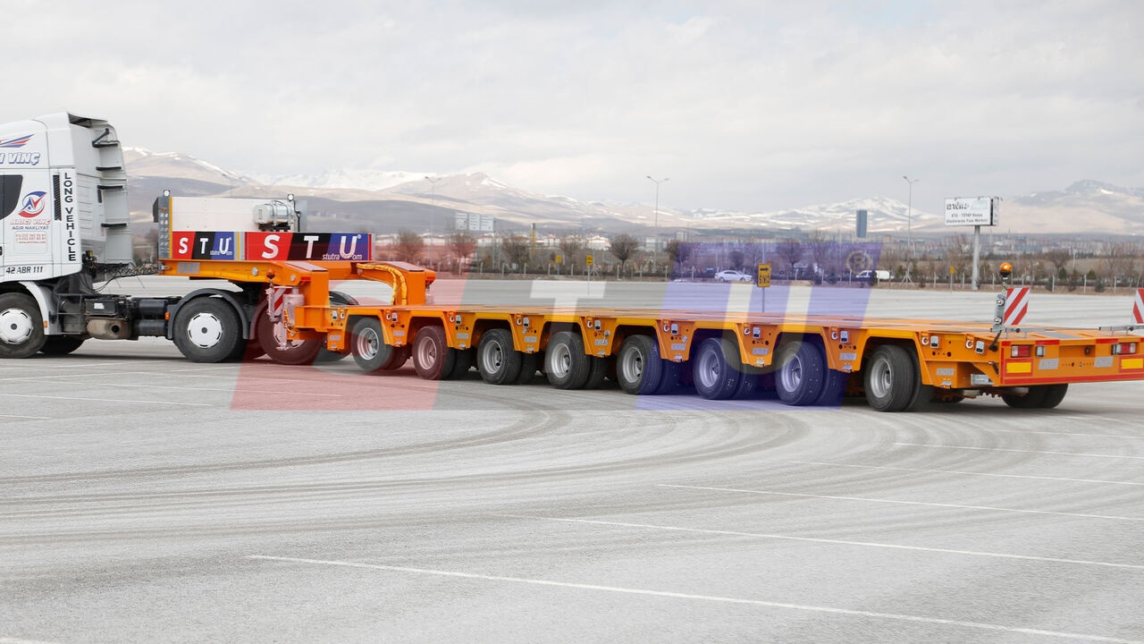 STU 8 AXLE LOWBED- HYDRAULIC STEERING AXLES / 8 ESSİEUX SURBAISSES-E - Félpótkocsi mélybölcsős: 1 kép. STU 8 AXLE LOWBED- HYDRAULIC STEERING AXLES / 8 ESSİEUX SURBAISSES-E - Félpótkocsi mélybölcsős: 1 kép.