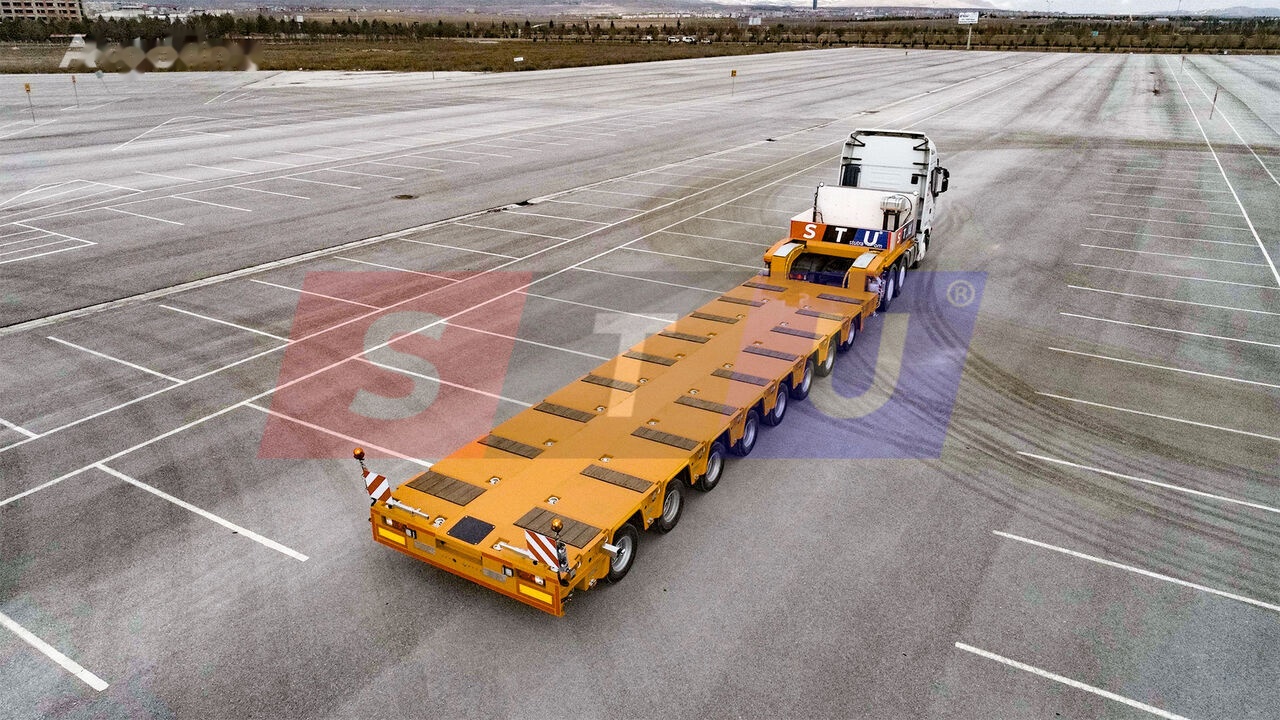 STU 8 AXLE LOWBED- HYDRAULIC STEERING AXLES / 8 ESSİEUX SURBAISSES-E - Félpótkocsi mélybölcsős: 2 kép. STU 8 AXLE LOWBED- HYDRAULIC STEERING AXLES / 8 ESSİEUX SURBAISSES-E - Félpótkocsi mélybölcsős: 2 kép.