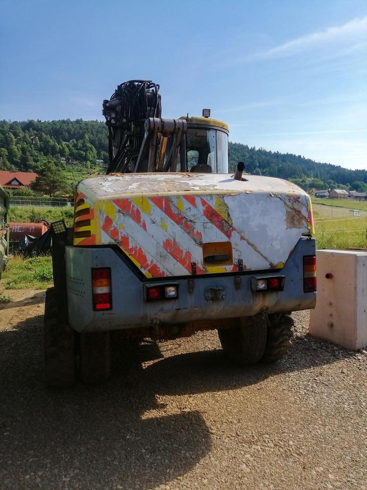 MECALAC 14 MXT - Gumikerekes kotró: 2 kép. MECALAC 14 MXT - Gumikerekes kotró: 2 kép.