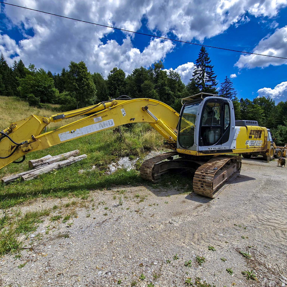 New Holland Kobelco E215 - Lánctalpas kotró: 2 kép. New Holland Kobelco E215 - Lánctalpas kotró: 2 kép.