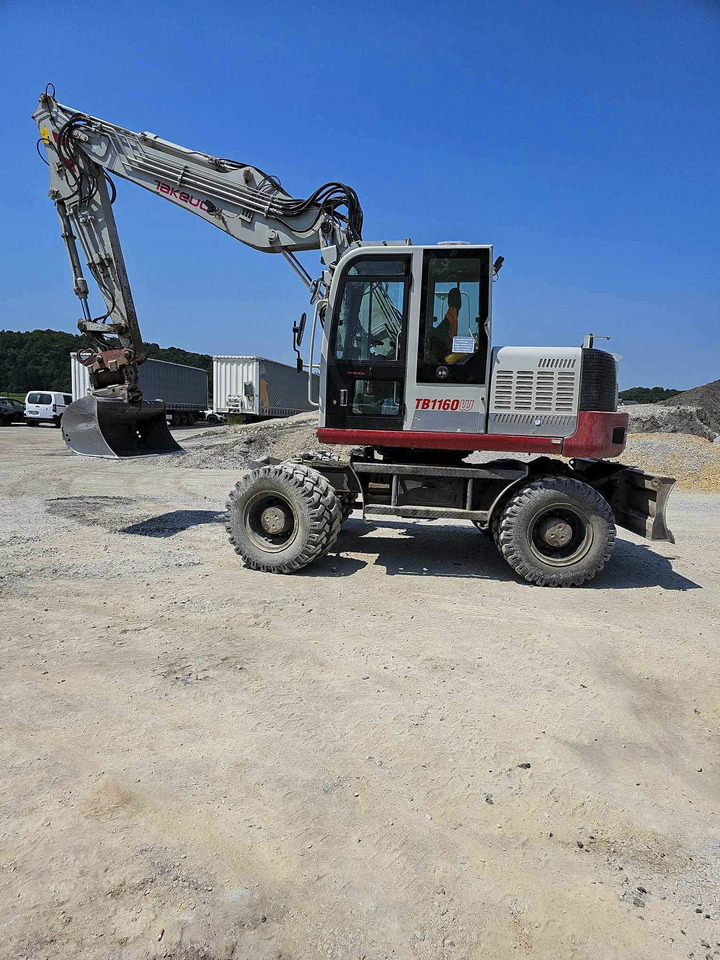 Takeuchi TB1160W - Gumikerekes kotró: 3 kép. Takeuchi TB1160W - Gumikerekes kotró: 3 kép.
