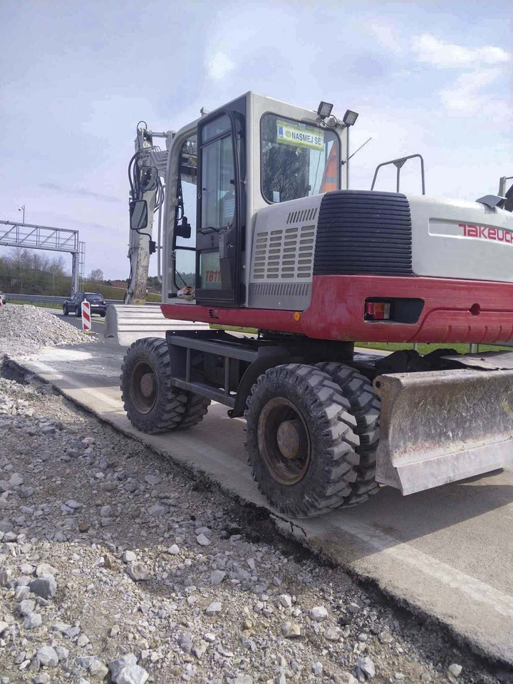 Takeuchi TB1160W - Gumikerekes kotró: 4 kép. Takeuchi TB1160W - Gumikerekes kotró: 4 kép.