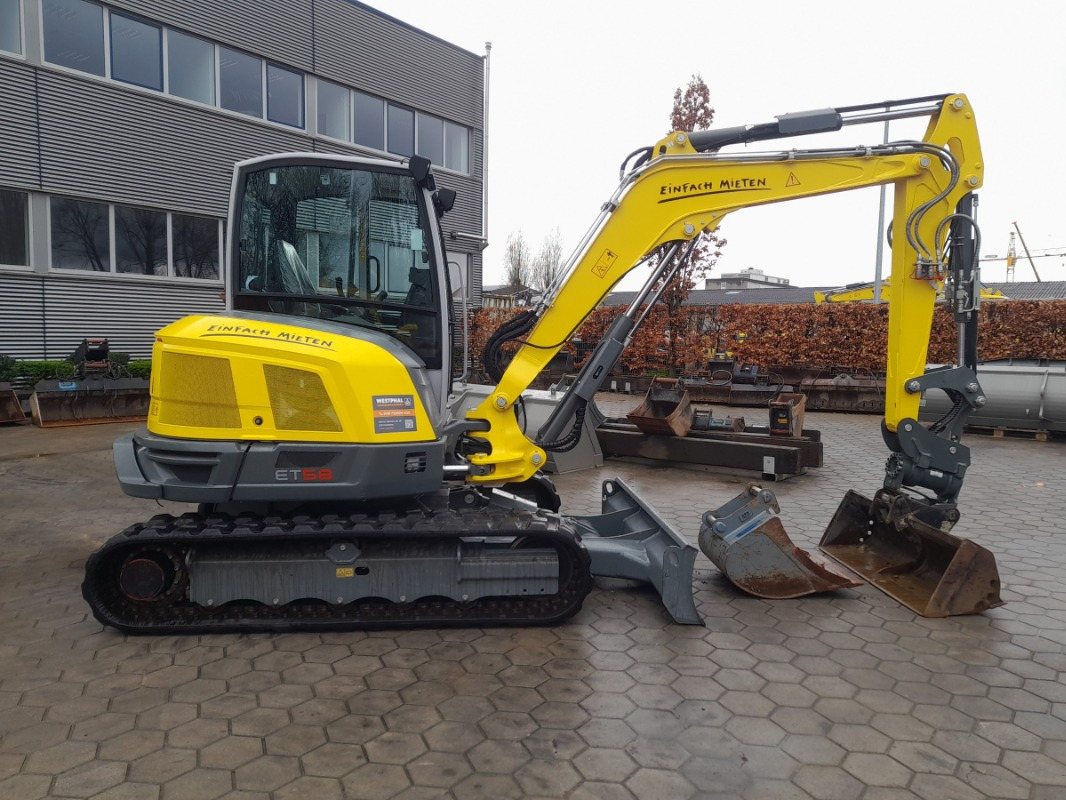 Neuson ET58 - Minikotró: 2 kép. Neuson ET58 - Minikotró: 2 kép.