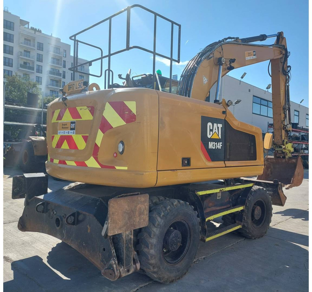 CAT M314F - Gumikerekes kotró: 3 kép. CAT M314F - Gumikerekes kotró: 3 kép.