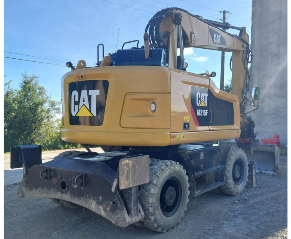 CAT M315F - Gumikerekes kotró: 3 kép. CAT M315F - Gumikerekes kotró: 3 kép.