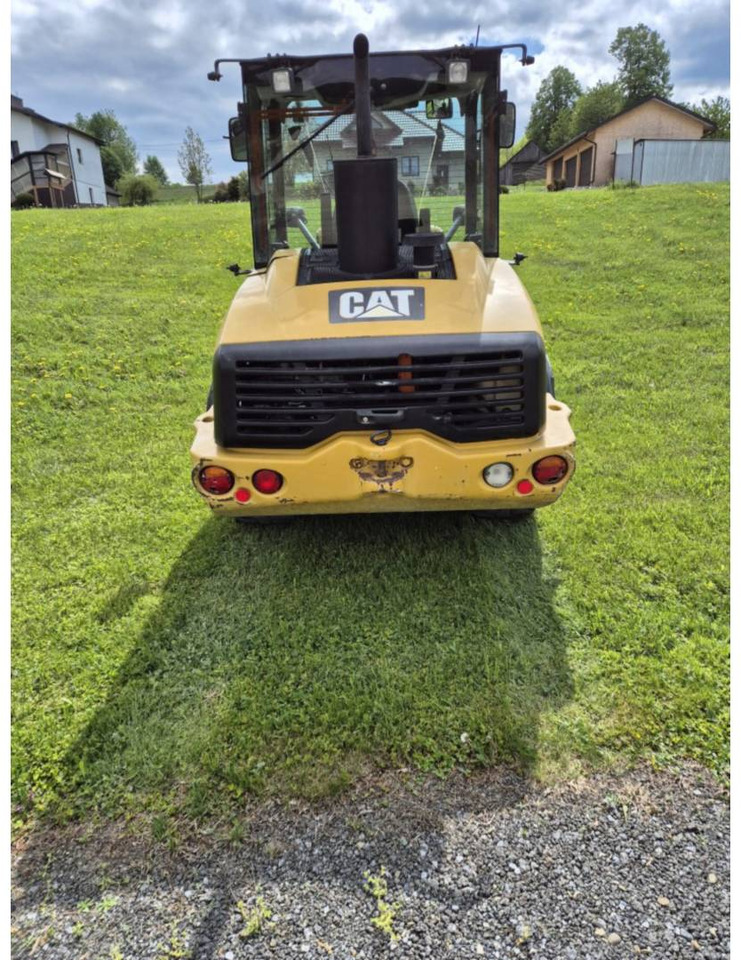 Gumikerekes homlokrakodó CAT 906H: 24 kép.