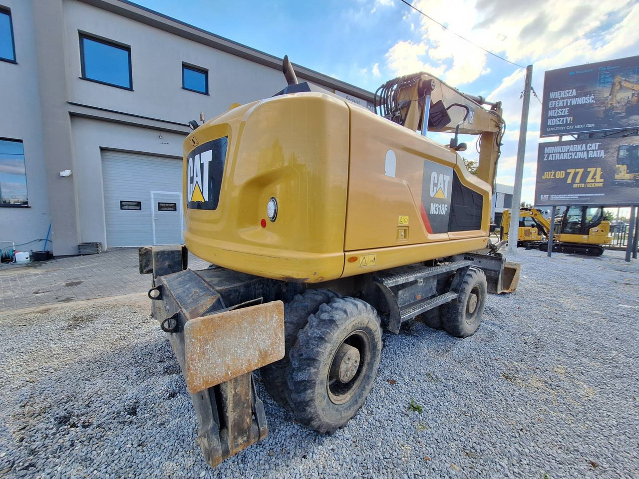 CAT M318F - Gumikerekes kotró: 3 kép. CAT M318F - Gumikerekes kotró: 3 kép.