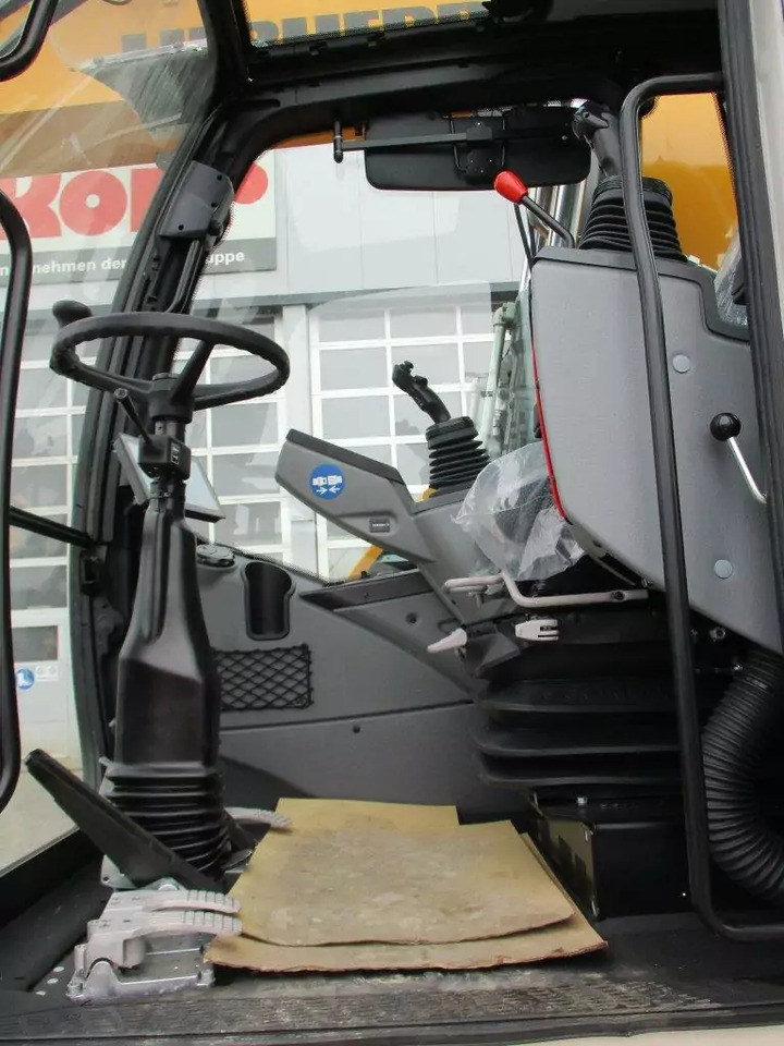 2023 Liebherr A 913 Compact G6.0-D Litronic - Gumikerekes kotró: 5 kép. 2023 Liebherr A 913 Compact G6.0-D Litronic - Gumikerekes kotró: 5 kép.