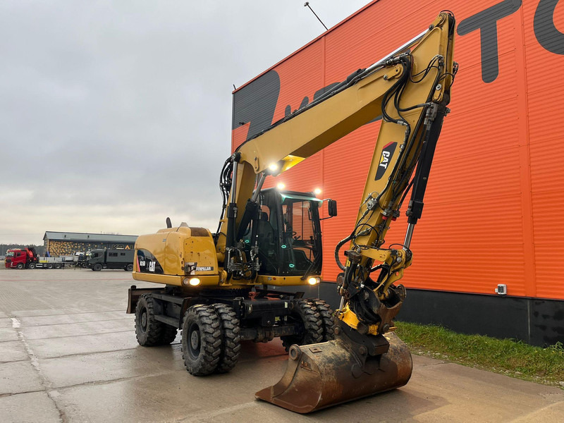 Caterpillar M316D / ROTOTILT/ AC / CENTRAL LUBRICATION / + EXTRA BUCKET - Gumikerekes kotró: 3 kép. Caterpillar M316D / ROTOTILT/ AC / CENTRAL LUBRICATION / + EXTRA BUCKET - Gumikerekes kotró: 3 kép.