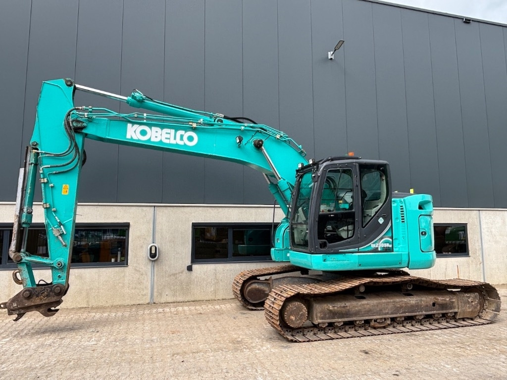 Kobelco SK 230 SR LC - SK230SRLC-5 - SK230 - Lánctalpas kotró: 2 kép. Kobelco SK 230 SR LC - SK230SRLC-5 - SK230 - Lánctalpas kotró: 2 kép.