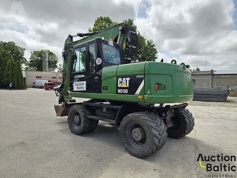 Caterpillar M315D - Gumikerekes kotró: 4 kép. Caterpillar M315D - Gumikerekes kotró: 4 kép.
