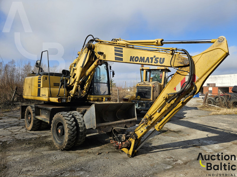 Komatsu PW130ES-6K - Gumikerekes kotró: 2 kép. Komatsu PW130ES-6K - Gumikerekes kotró: 2 kép.