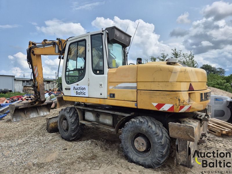 Liebherr A 316 Litronic - Gumikerekes kotró: 4 kép. Liebherr A 316 Litronic - Gumikerekes kotró: 4 kép.
