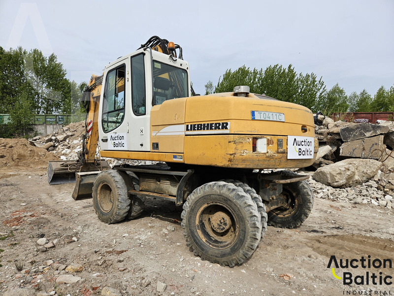 Liebherr A 316 Litronic - Gumikerekes kotró: 4 kép. Liebherr A 316 Litronic - Gumikerekes kotró: 4 kép.