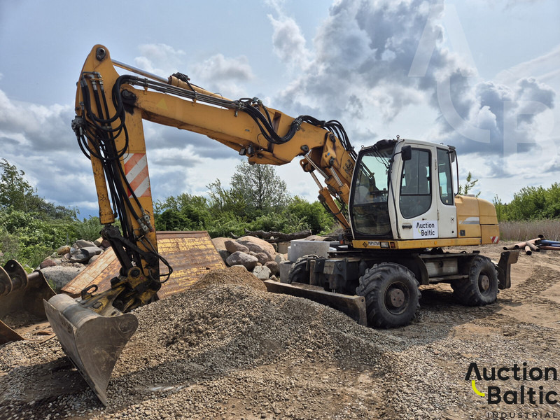 Liebherr A 316 Litronic - Gumikerekes kotró: 1 kép. Liebherr A 316 Litronic - Gumikerekes kotró: 1 kép.
