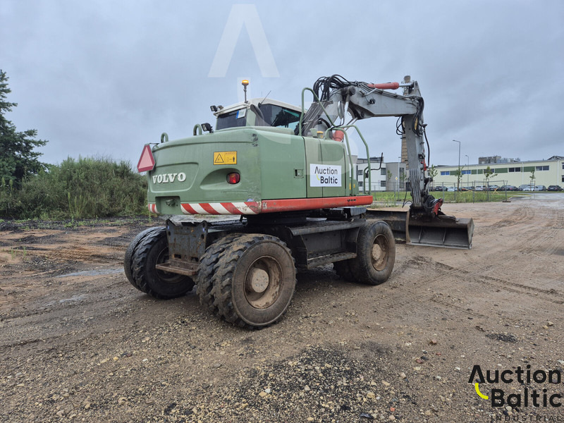 Volvo EW 140 C - Gumikerekes kotró: 4 kép. Volvo EW 140 C - Gumikerekes kotró: 4 kép.