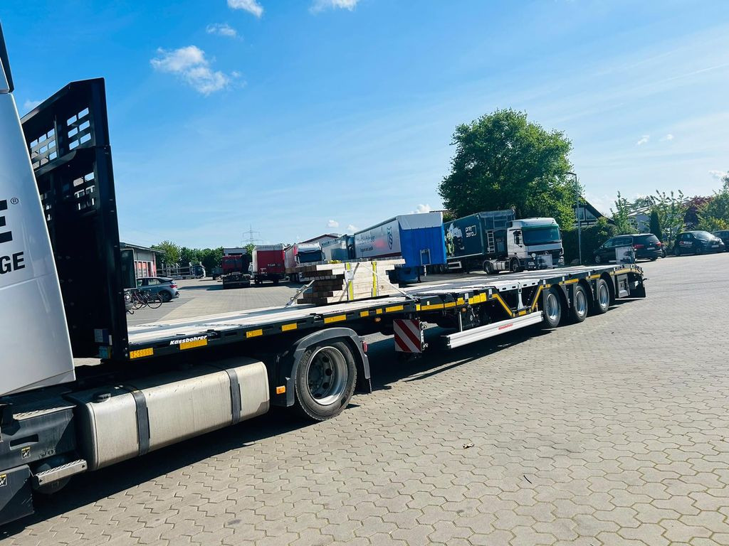 Kässbohrer Mega Tele HD Plattform Auflieger mit Radmulden - Platós félpótkocsi: 1 kép. Kässbohrer Mega Tele HD Plattform Auflieger mit Radmulden - Platós félpótkocsi: 1 kép.
