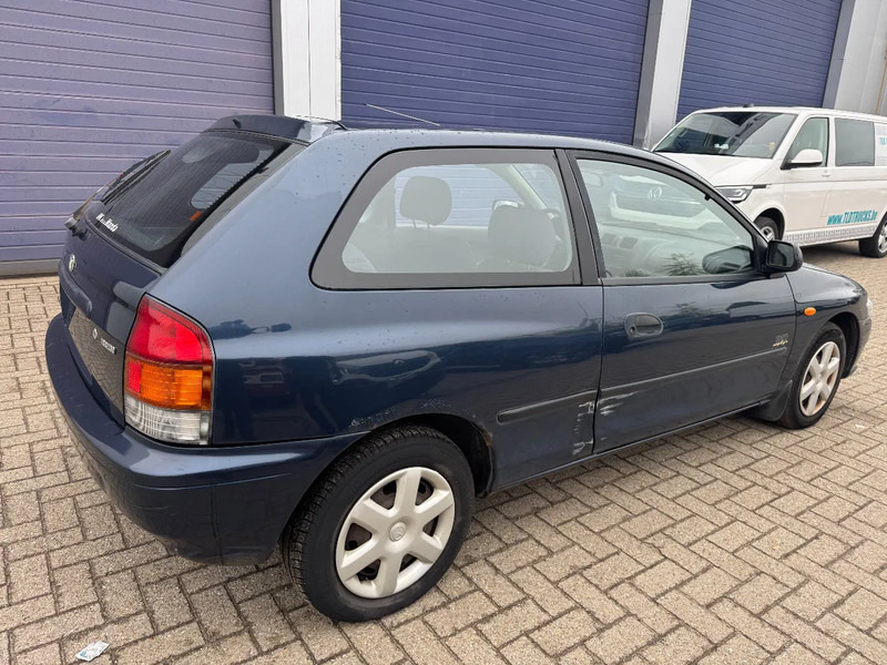 Mazda 323 **PETROL-ESSENCE-BELGIUM CAR** - Szedán: 4 kép. Mazda 323 **PETROL-ESSENCE-BELGIUM CAR** - Szedán: 4 kép.