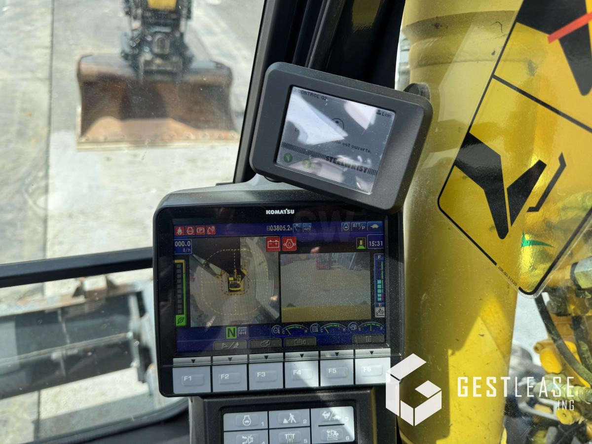 Gumikerekes kotró Komatsu PW148-11: 16 kép.