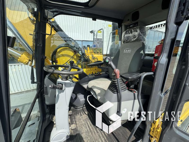 Gumikerekes kotró Komatsu PW148-11: 13 kép.