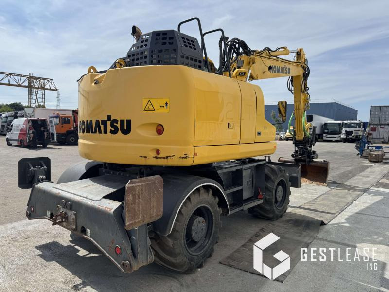 Komatsu PW148-11 - Gumikerekes kotró: 3 kép. Komatsu PW148-11 - Gumikerekes kotró: 3 kép.