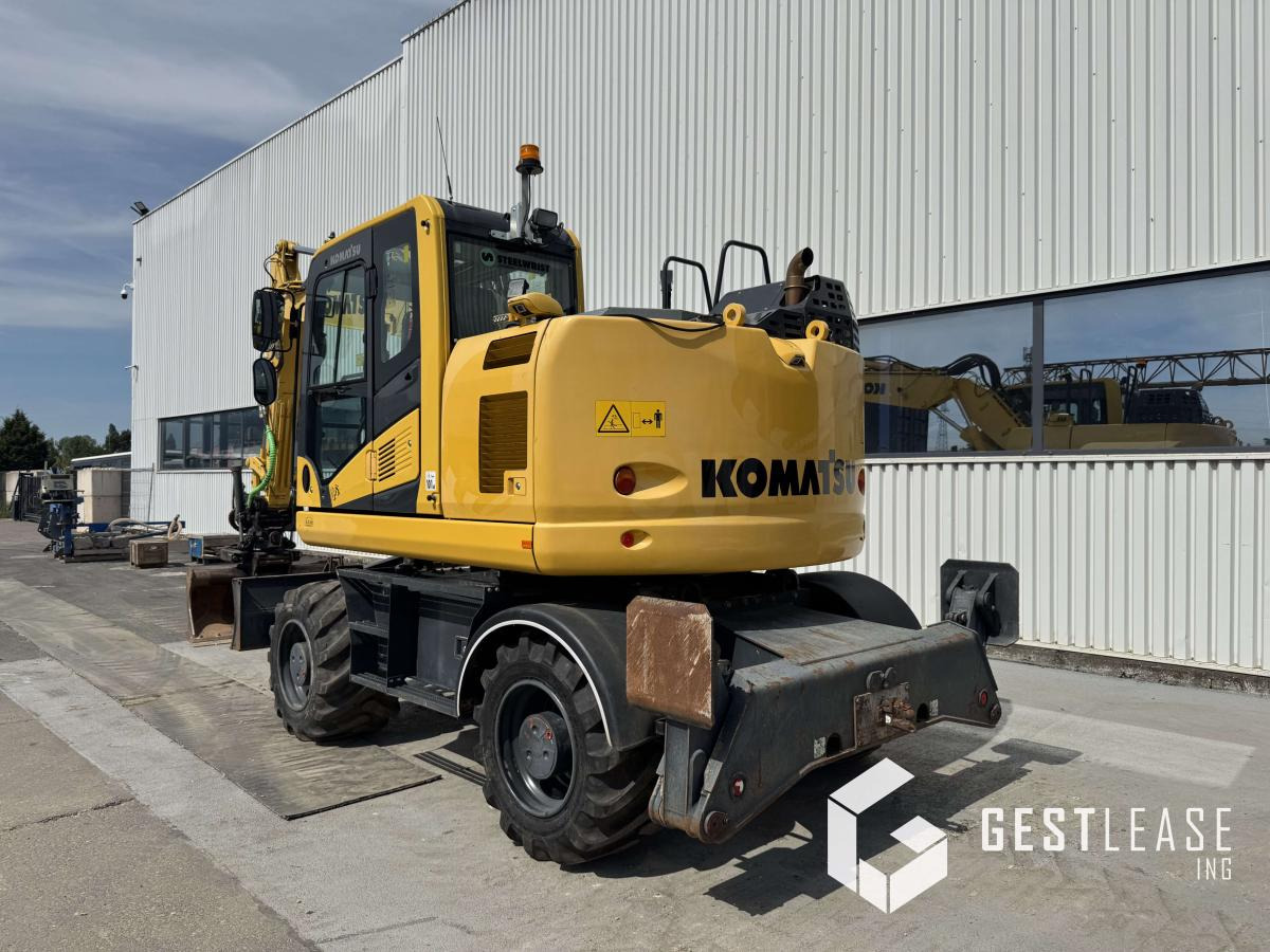 Komatsu PW148-11 - Gumikerekes kotró: 2 kép. Komatsu PW148-11 - Gumikerekes kotró: 2 kép.
