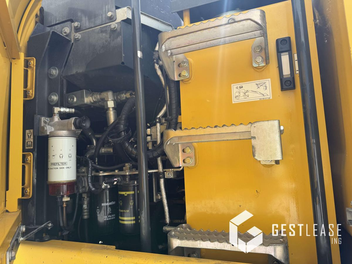 Gumikerekes kotró Komatsu PW148-11: 11 kép.
