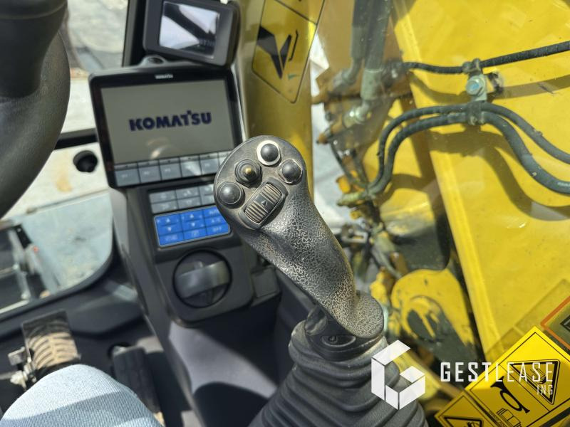 Gumikerekes kotró Komatsu PW148-11: 14 kép.