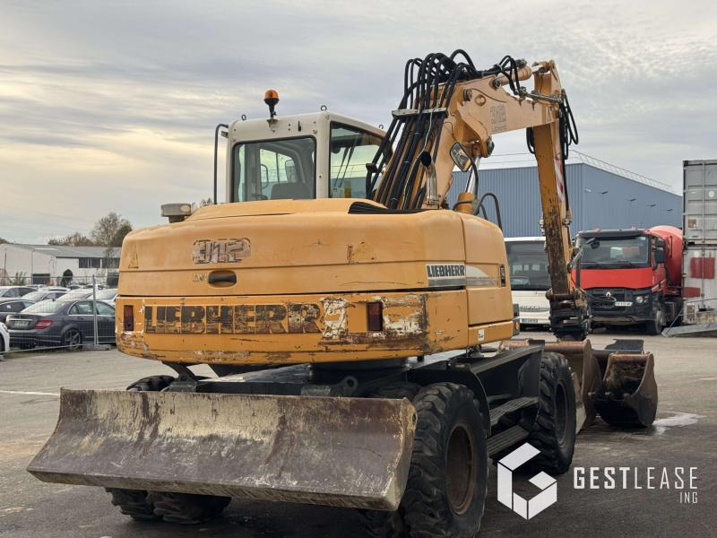 Liebherr A312 Litronic - Gumikerekes kotró: 3 kép. Liebherr A312 Litronic - Gumikerekes kotró: 3 kép.