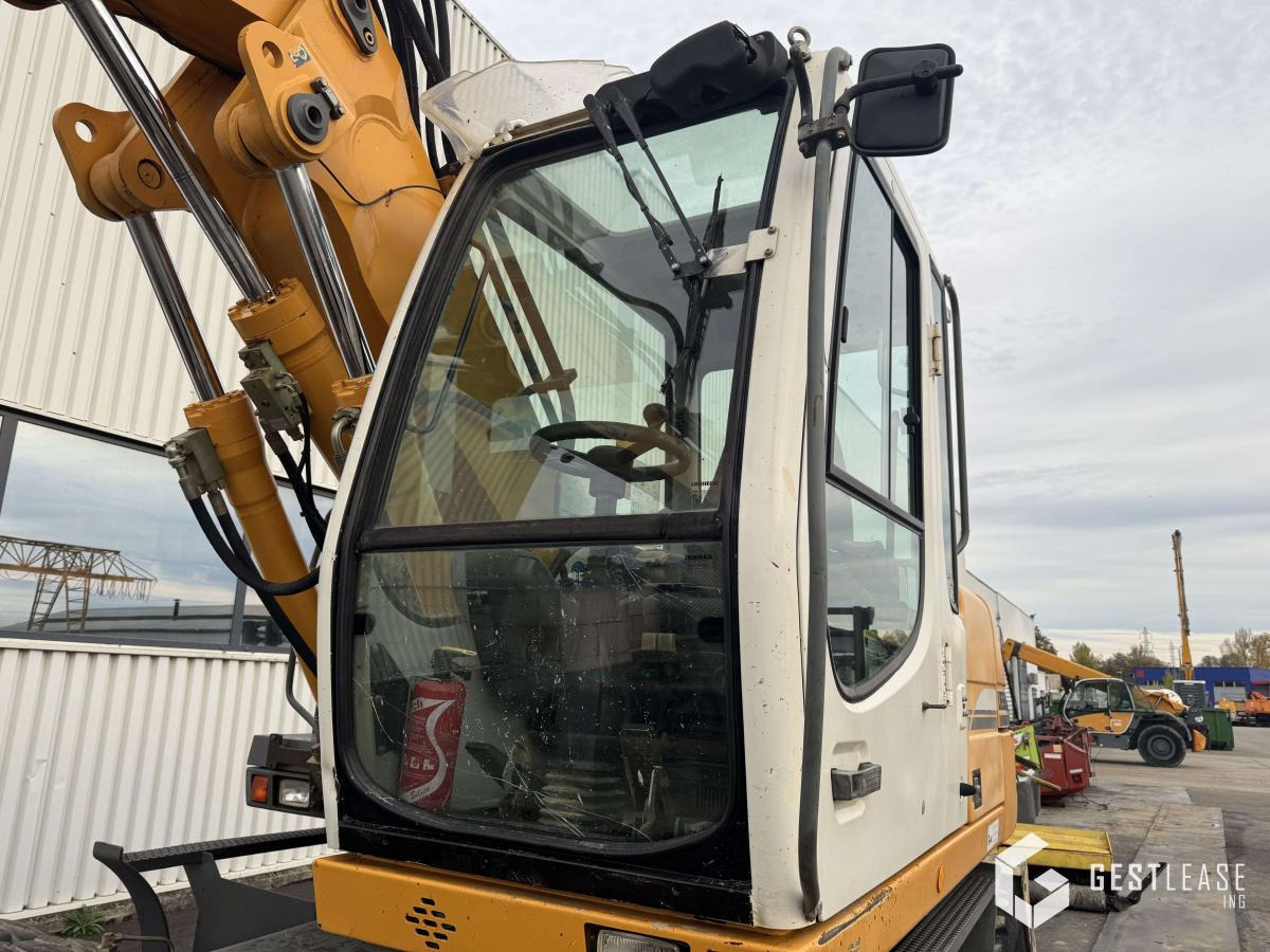 Gumikerekes kotró Liebherr A312 Litronic: 20 kép. Gumikerekes kotró Liebherr A312 Litronic: 20 kép.