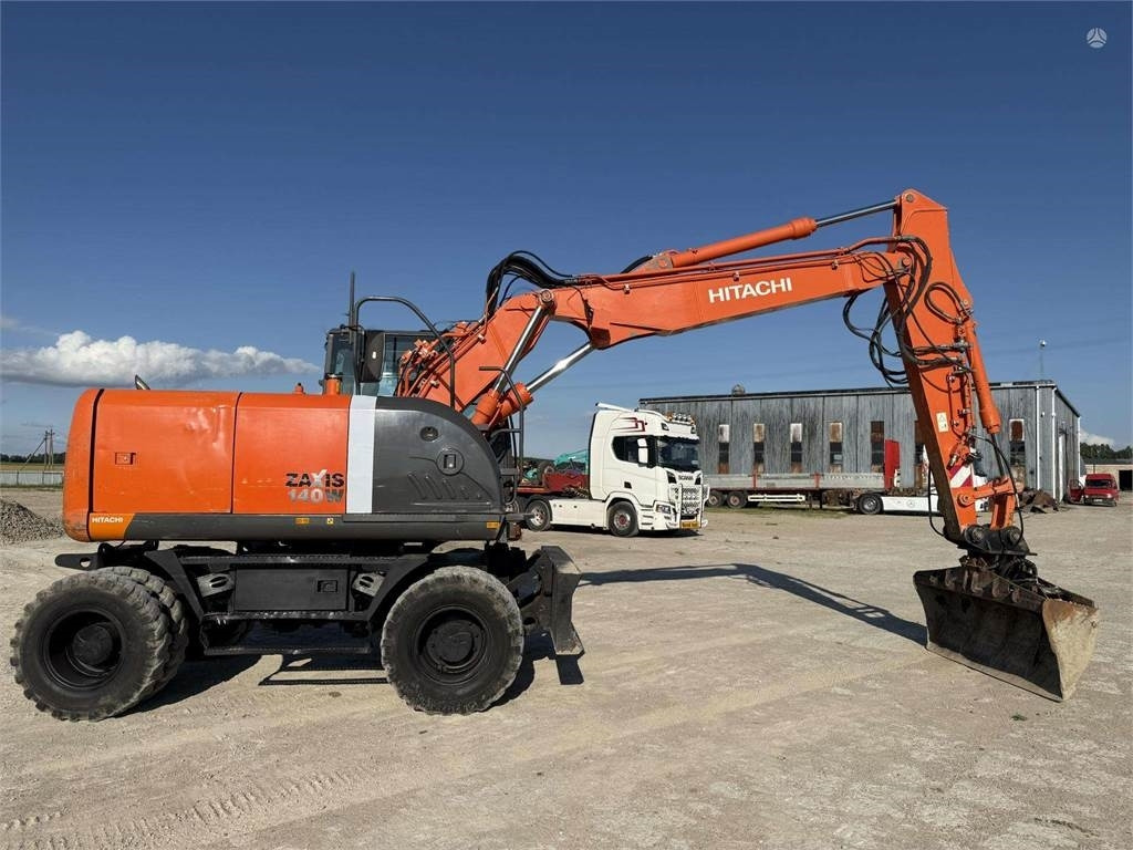 Hitachi ZX 140 W - Gumikerekes kotró: 5 kép. Hitachi ZX 140 W - Gumikerekes kotró: 5 kép.