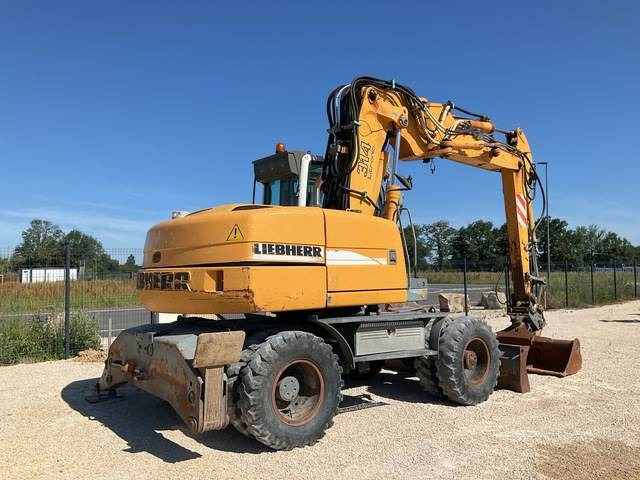 Liebherr A314 - Gumikerekes kotró: 4 kép. Liebherr A314 - Gumikerekes kotró: 4 kép.