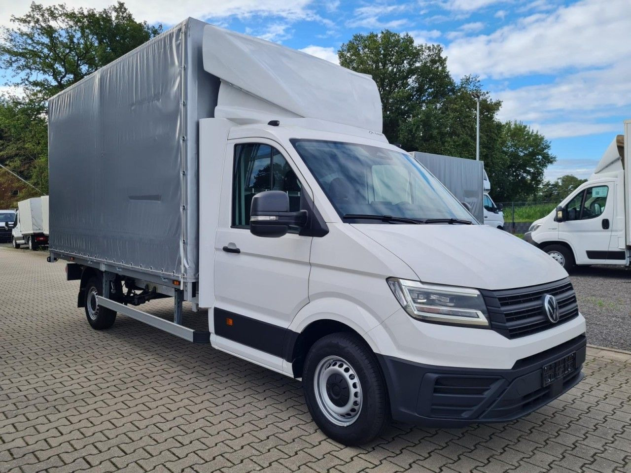 Volkswagen Crafter 35 TDI Pritsche Schiebe Plane ERGO LED T - Ponyvás kisteherautó: 3 kép. Volkswagen Crafter 35 TDI Pritsche Schiebe Plane ERGO LED T - Ponyvás kisteherautó: 3 kép.