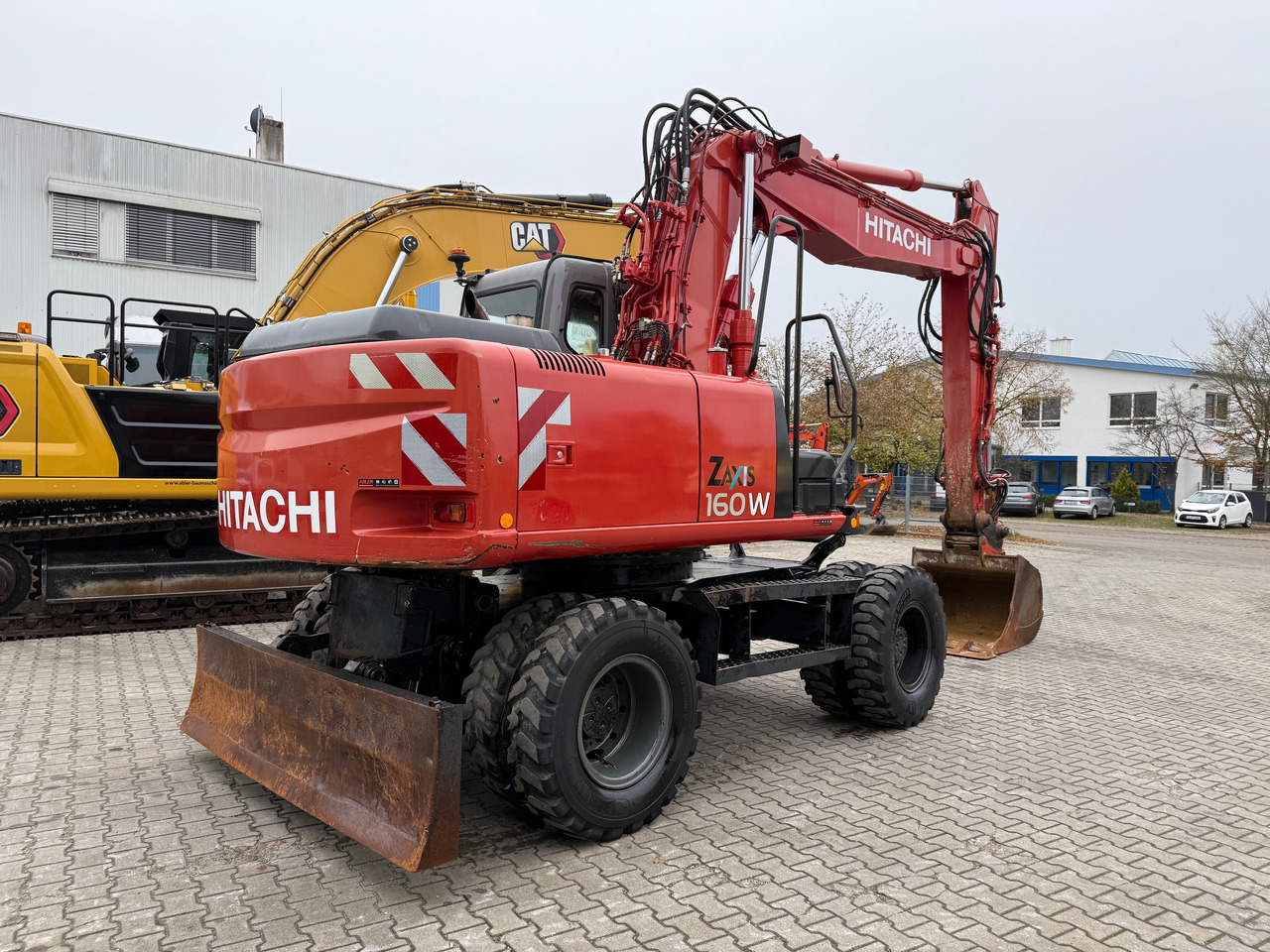 Hitachi ZX 160 W Mobilbagger Klima Zentralschmierung OQ 60-5 - Gumikerekes kotró: 4 kép. Hitachi ZX 160 W Mobilbagger Klima Zentralschmierung OQ 60-5 - Gumikerekes kotró: 4 kép.
