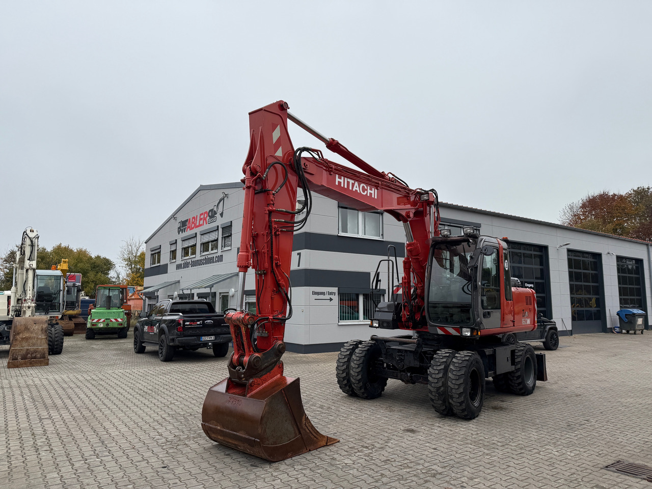 Hitachi ZX 160 W Mobilbagger Klima Zentralschmierung OQ 60-5 - Gumikerekes kotró: 2 kép. Hitachi ZX 160 W Mobilbagger Klima Zentralschmierung OQ 60-5 - Gumikerekes kotró: 2 kép.