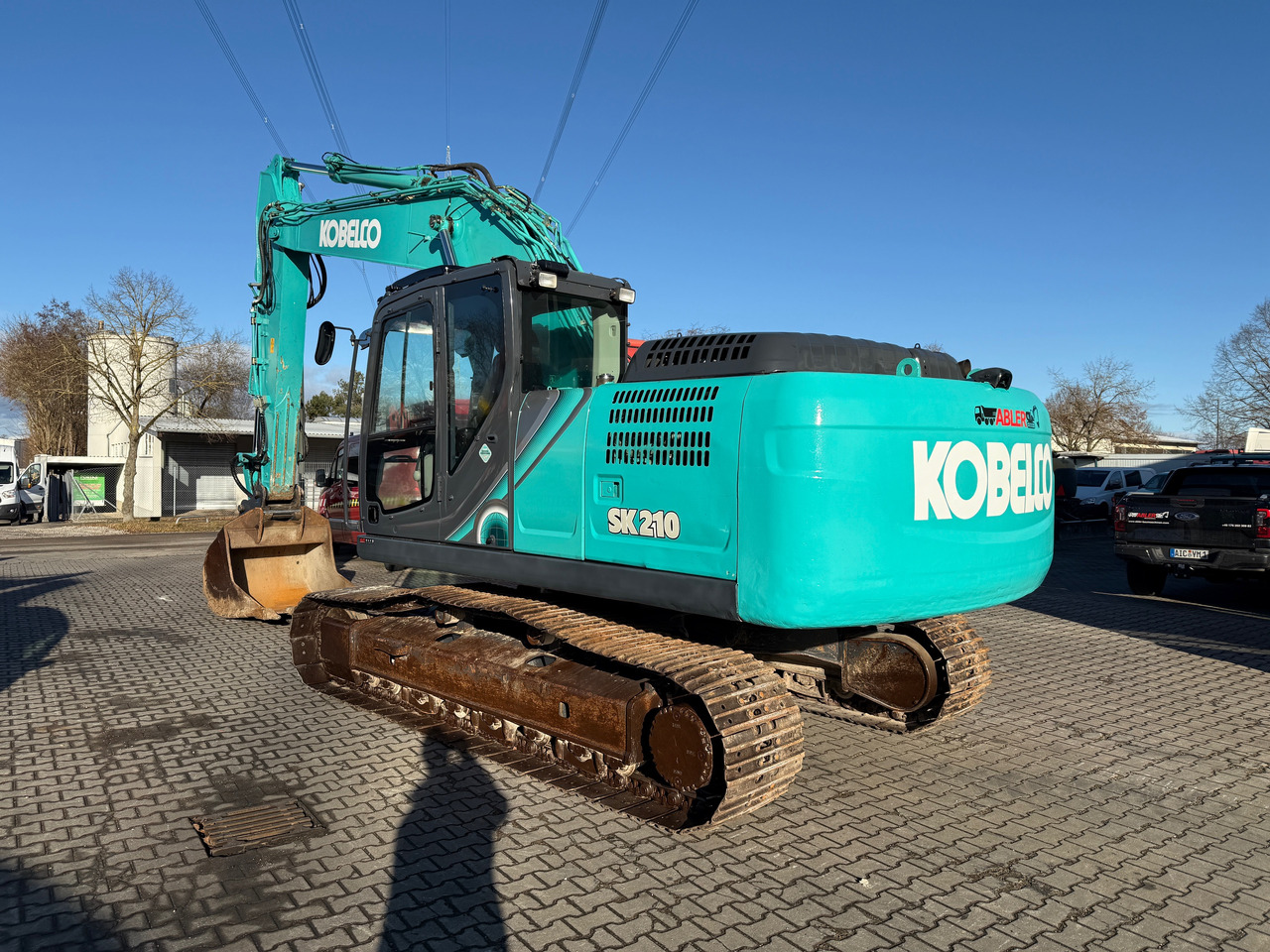 Kobelco SK210 NLC-10 Kettenbagger Oilquick Klima - Lánctalpas kotró: 5 kép. Kobelco SK210 NLC-10 Kettenbagger Oilquick Klima - Lánctalpas kotró: 5 kép.