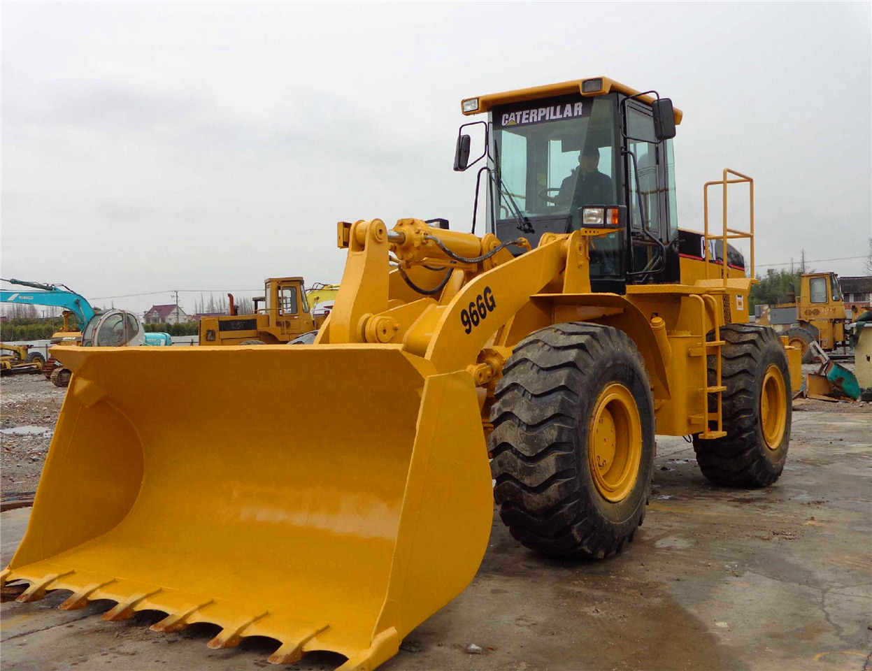 Caterpillar 966G - Gumikerekes homlokrakodó: 4 kép. Caterpillar 966G - Gumikerekes homlokrakodó: 4 kép.