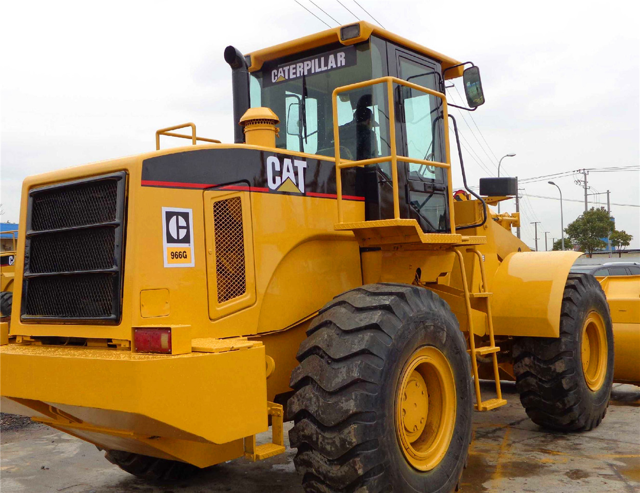 Caterpillar 966G - Gumikerekes homlokrakodó: 2 kép. Caterpillar 966G - Gumikerekes homlokrakodó: 2 kép.